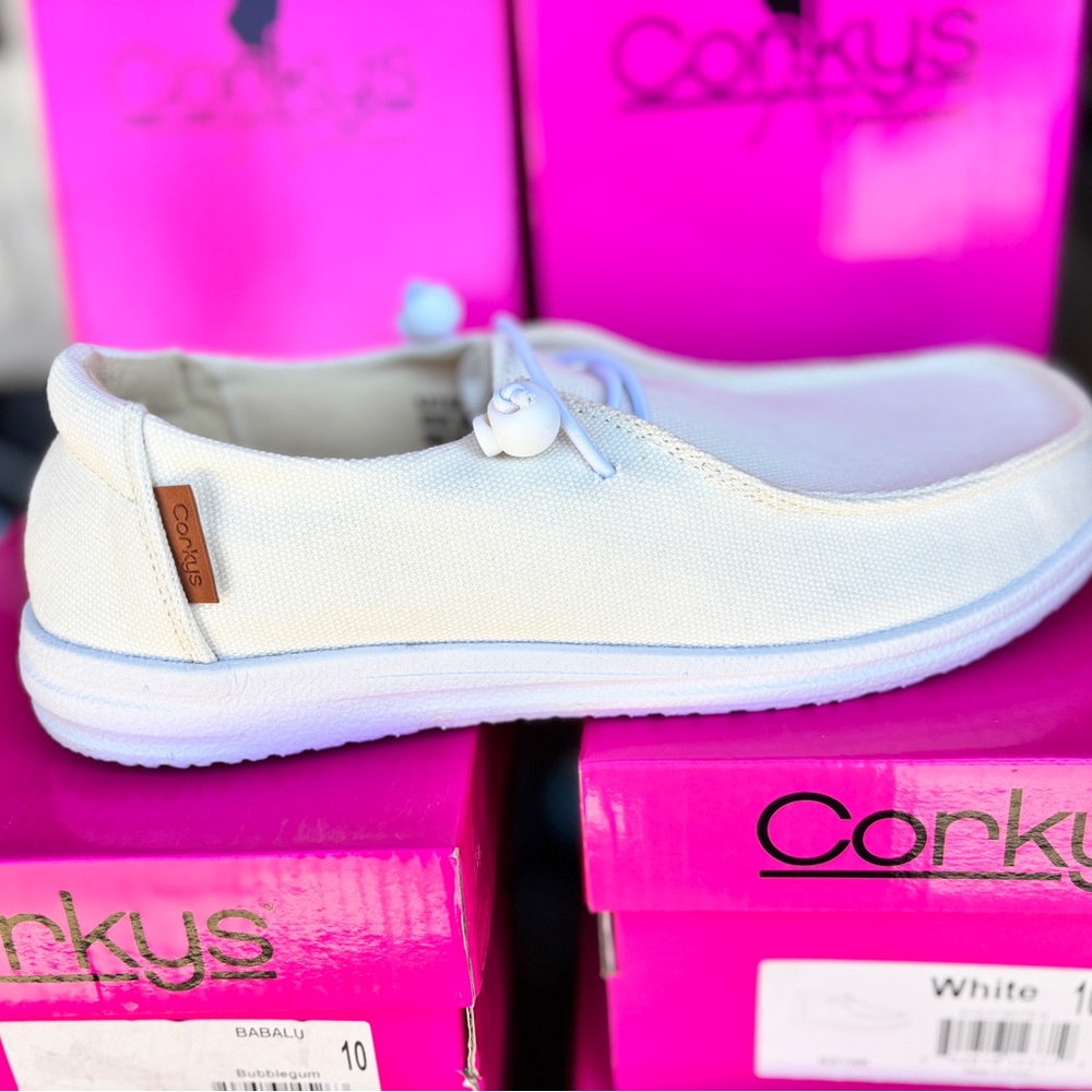 Colors Tan or White listing Kayak slide on sneakers by Corkys
